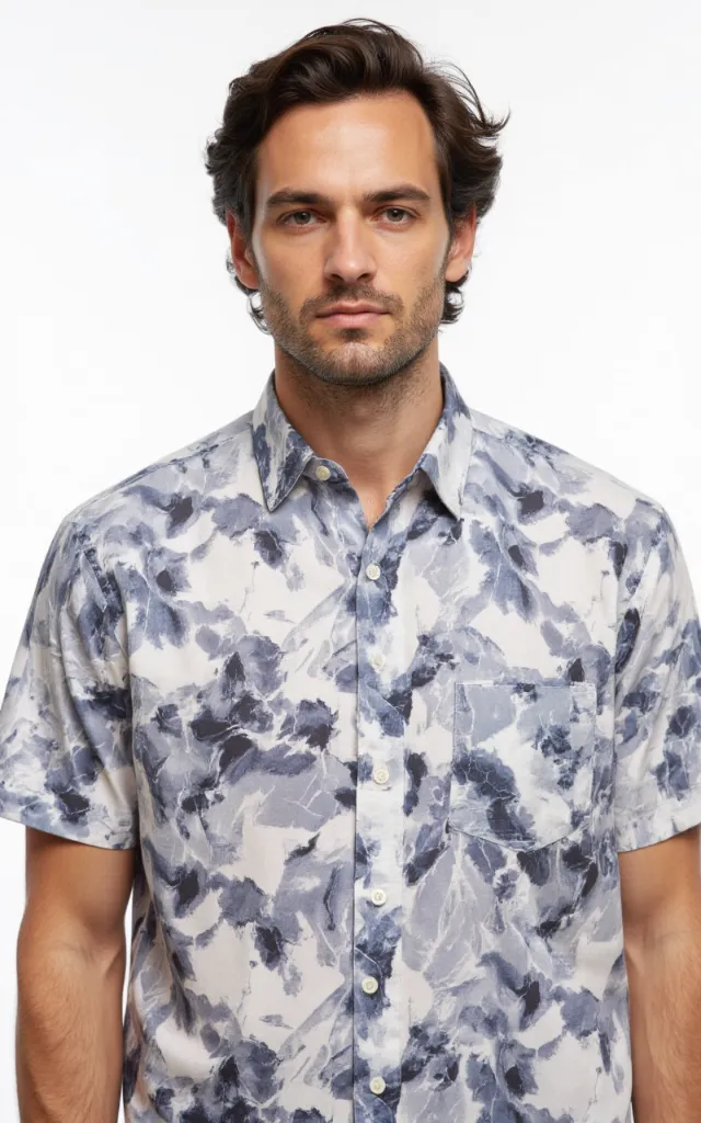 A French model wearing a Lightning   bolt pattern   printed shirt, against a white background, in a front   facing bust portrait